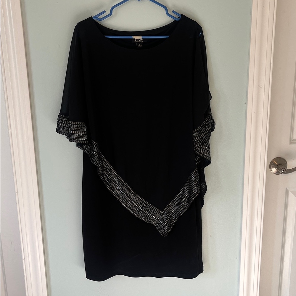 Elegant Black Women's Dress with Embellished Details. Has sheer open shoulder.